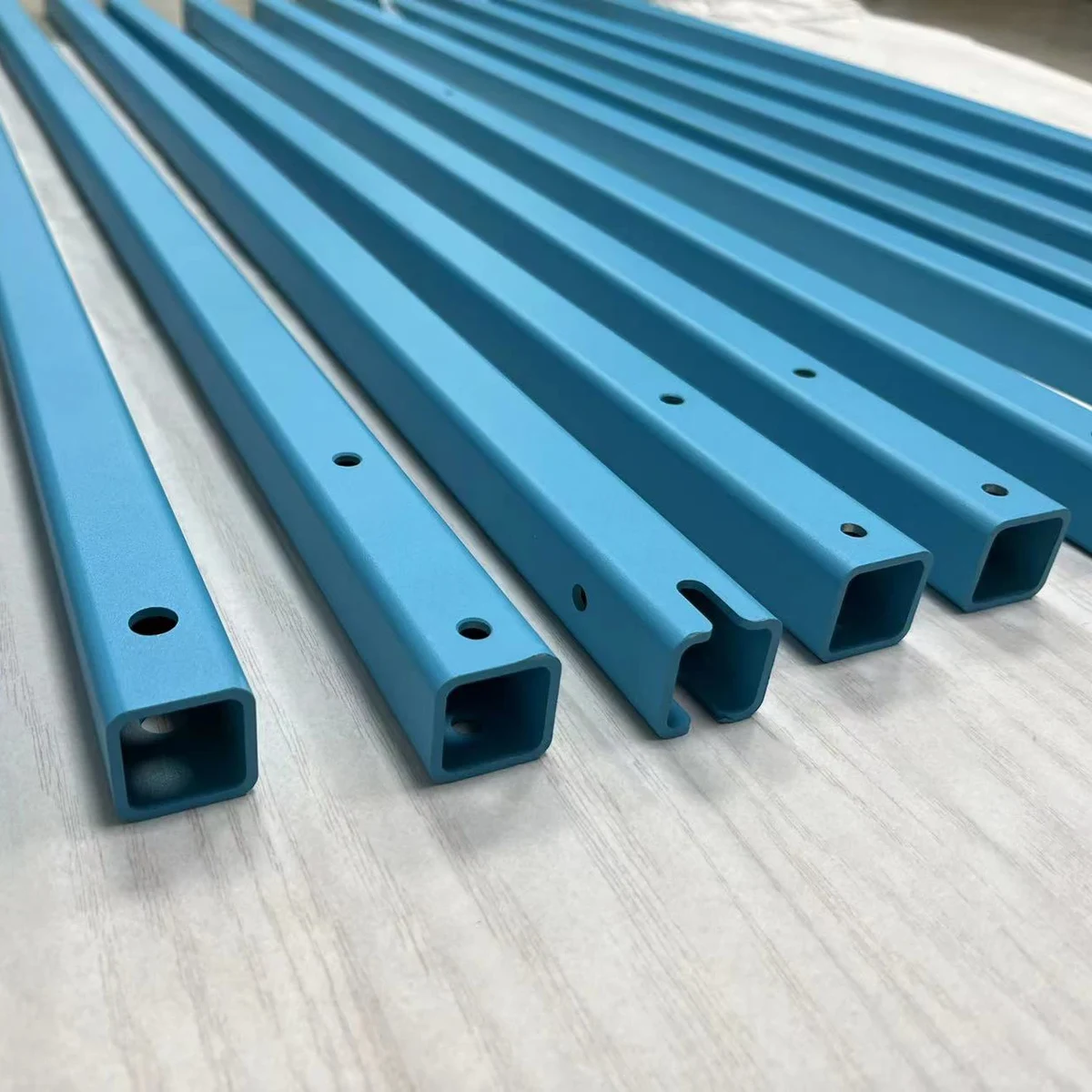 Blue-finished machined square tubes — catalog reference photograph
